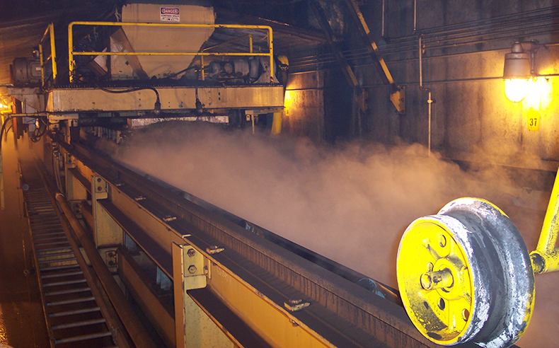 Conveyor transfer point dust control using Dry Fog